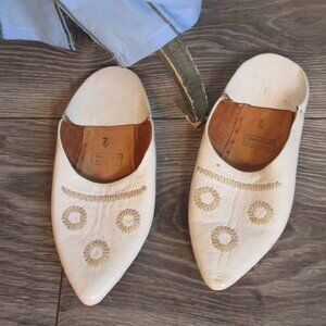 White leather slippers made in Egypt with beige stitching. 7.5 women size?